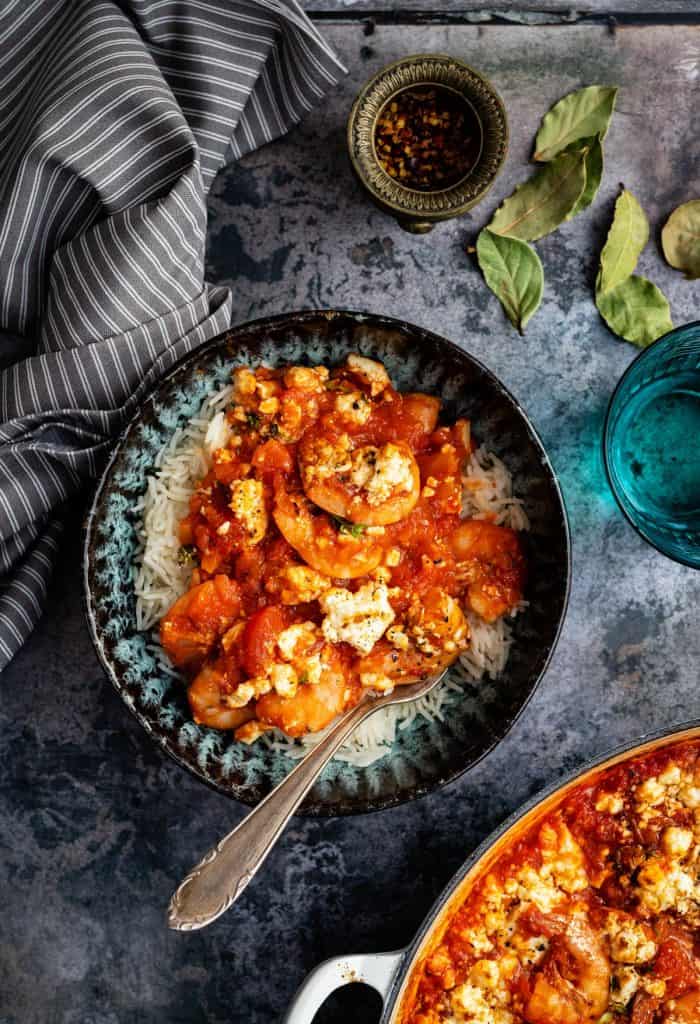 Prawn saganaki served over rice in a small bowl