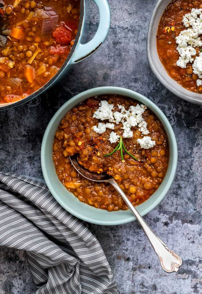 Lentil soup served with a little feta cheese in a bowl