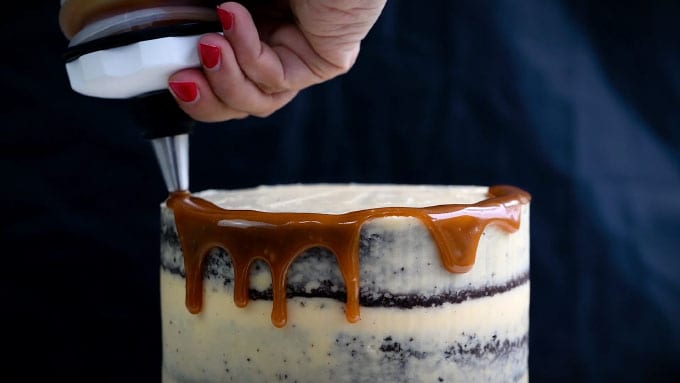 Adding a caramel drizzle to cake