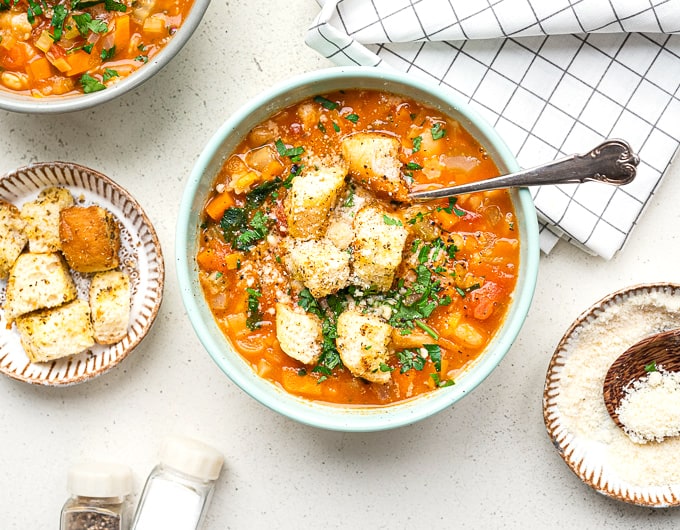 Classic Italian Minestrone Soup served with croutons and Parmesan