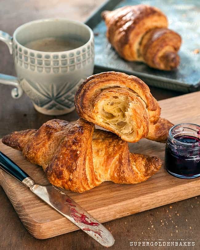close up on homemade croissants on a wooden board
