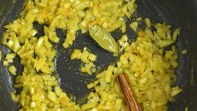cooking diced onion in spiced butter 