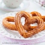 Surprise your loved one with these totally irresistible heart-shaped churros with chocolate sauce. Perfect for Valentine's day!