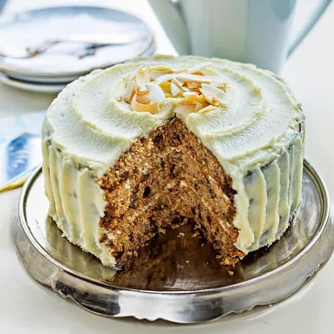 Healthier carrot cake with no added sugar on a metal cake plate