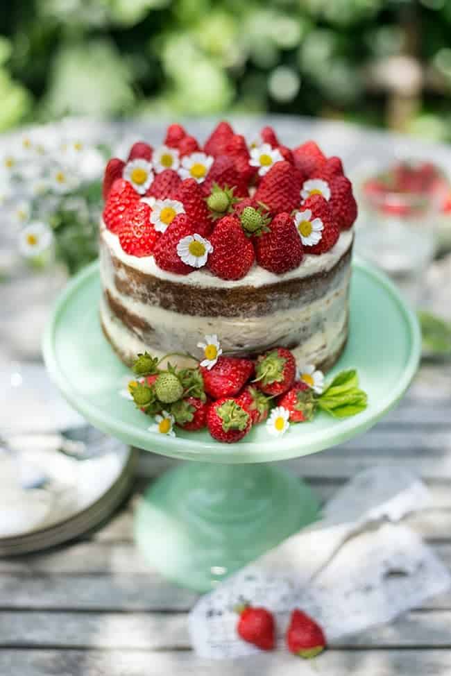 A spectacular strawberries and cream naked cake that's perfect for birthdays, celebrations, wedding and baby showers.