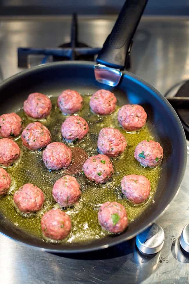 Frying Swedish meatballs in a pan