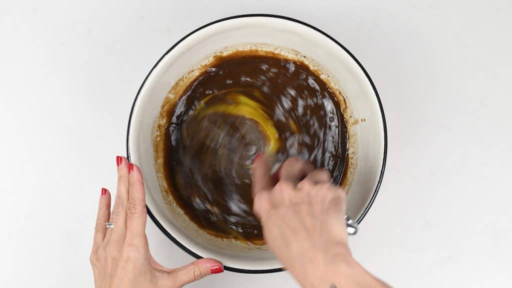 Mixing ingredients for gingerbread in a bowl