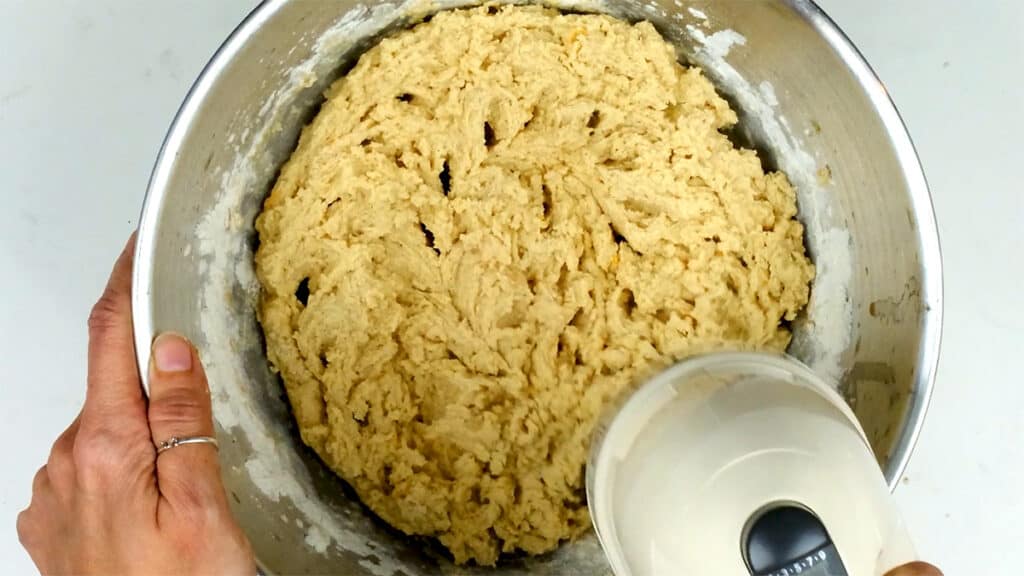 Making melomakarona dough in a mixing bowl