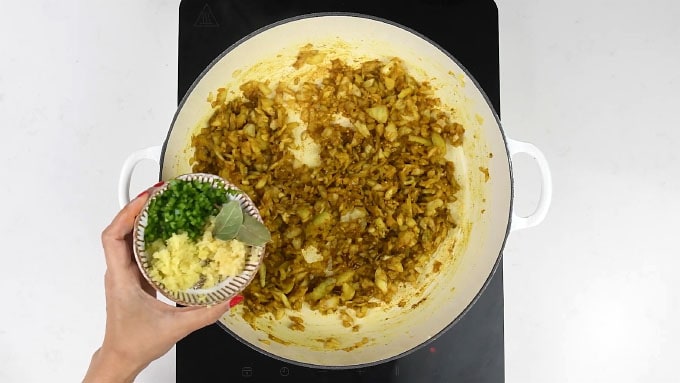 Adding ginger garlic and chillies to prawn dhansak curry