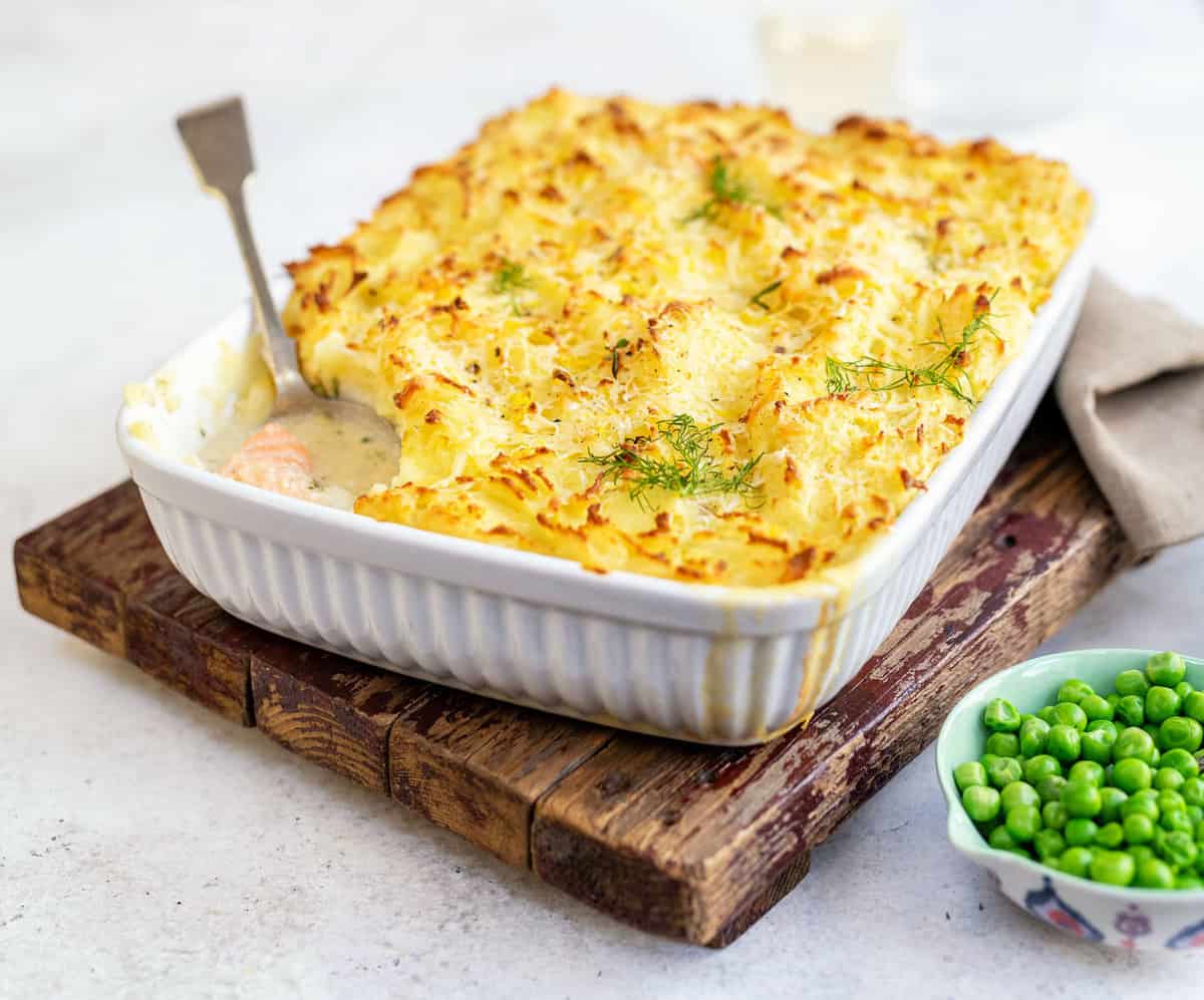 Fish pie with mashed potato topping in an ovenproof dish