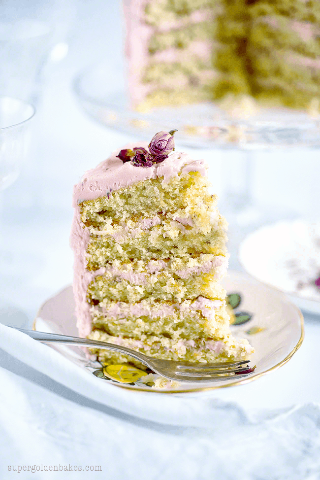Slice of rose and lemon cake showing five thin layers