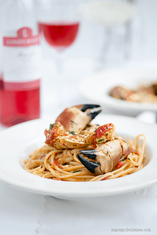 crab pasta topped with crab claws