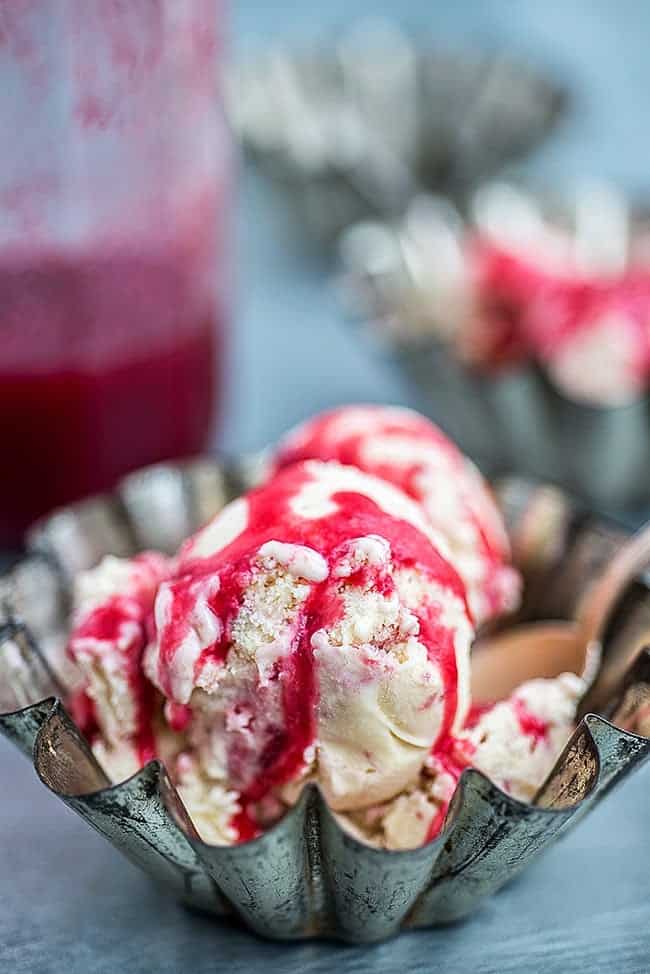 Rhubarb and raspberry ice cream drizzled with rhubarb and raspberry syrup