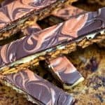 These super addictive, OTT chocolate caramel tiffin bars are the perfect bo-bake indulgent treat. Cut into small pieces and share responsibly!