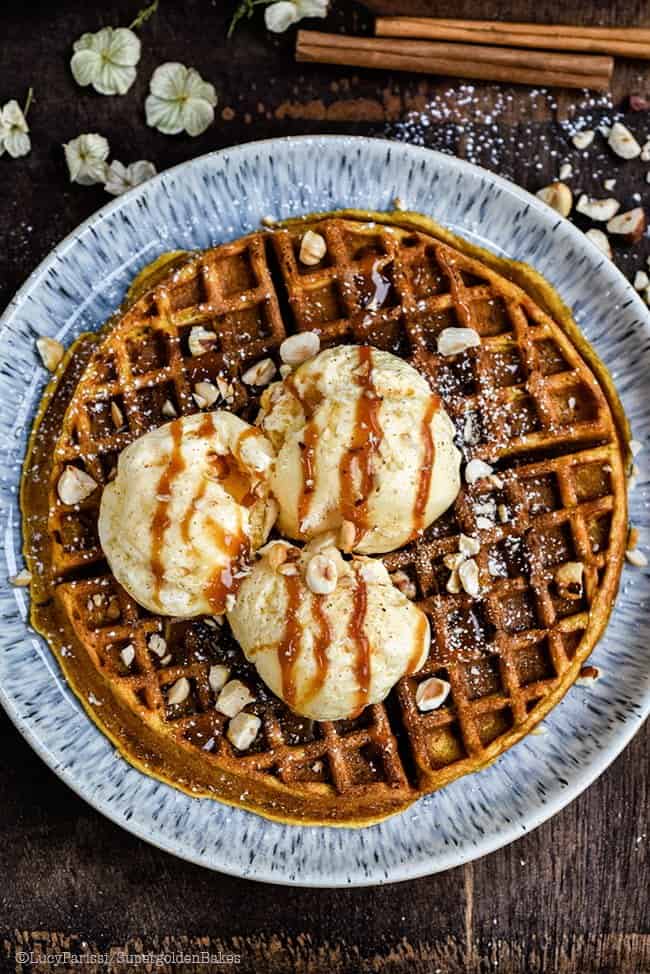 Pumpkin Spice Waffles served with vanilla ice cream and caramel sauce