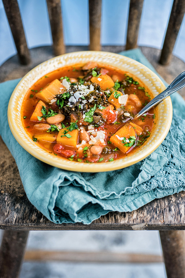 This hearty vegetarian slow cooker squash, bean, and kale stew is the perfect winter warmer. 