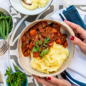 Bowl of Greek Beef Stifado stew served with mash
