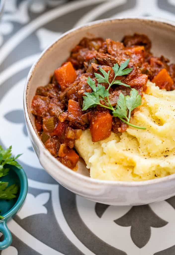 Serving of beef stifado with mashed potatoes