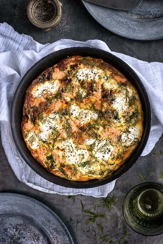 Smoked salmon frittata with cottage cheese and dill in a pan