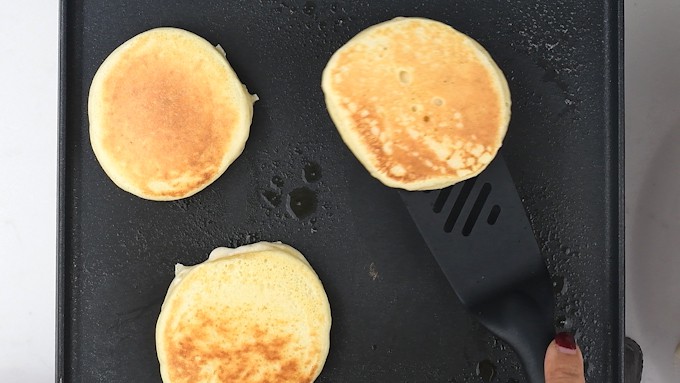 Making American style pancakes on a griddle