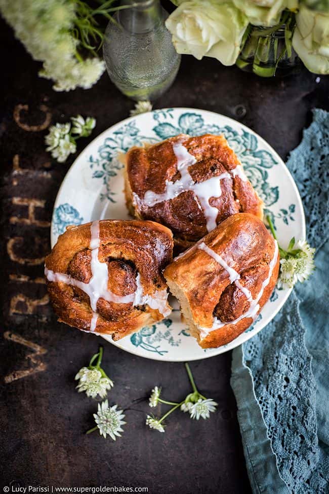 Pillowy soft, studded with raisins and fragrant with spices these irresistible hot cross cinnamon buns are simply perfect for Easter!