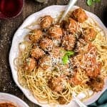 Super tasty beef meatballs in rich tomato sauce – let your slow cooker do most of the work! Serve with spaghetti and plenty of freshly grated Parmesan.