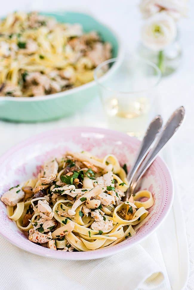 Tagliatelle Pasta with Chicken and Garlic Mushrooms served in a pink bowl 
