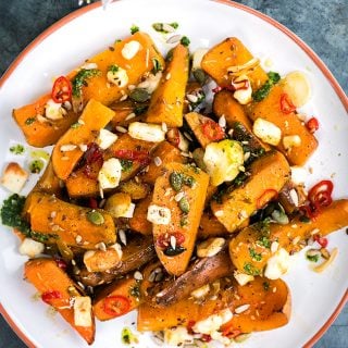 Honey-roasted sweet potato and squash with halloumi and basil oil