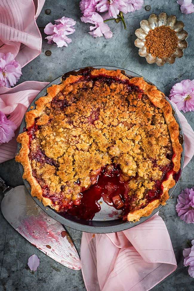 This rhubarb and raspberry pie with crumble topping walks the perfect line between sweet and tangy. Serve with vanilla ice cream for a slice of heaven!