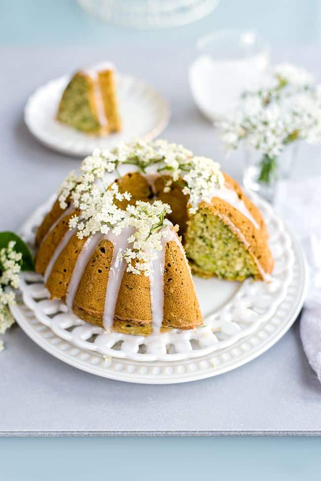 Wonderfully moist zucchini coconut bundt cake with elderflower glaze. Can be baked as a bundt or small loaf cake and it's great for breakfast or snacking. 