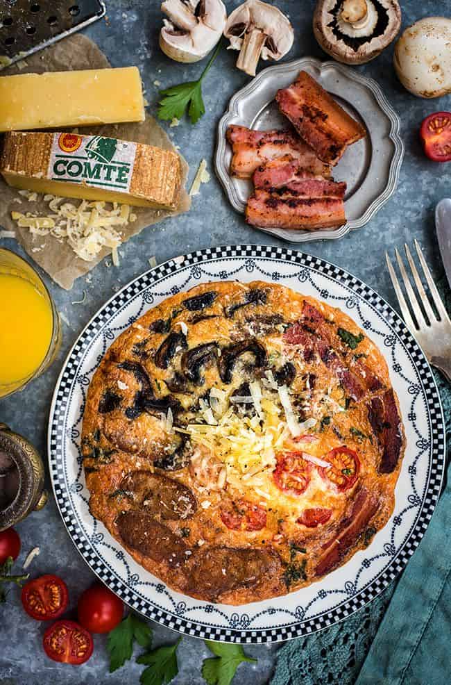 Fully Loaded Deep Dish Breakfast Frittata with Comté Cheese, Bacon, Sausages, Tomatoes and Mushrooms - perfect for brekfast, brunch or lunch. 