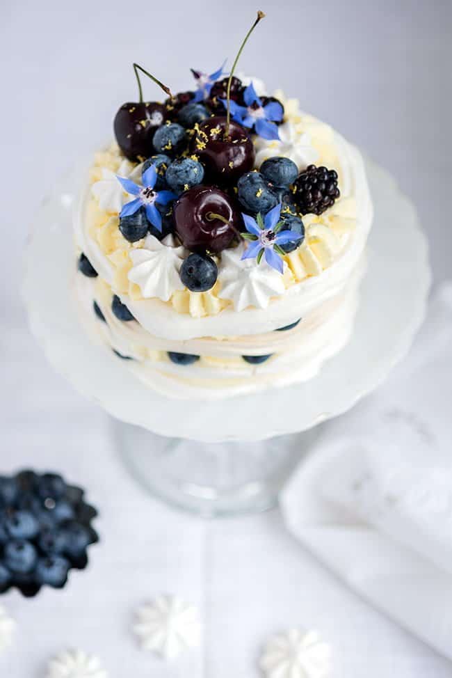 Meringue Stack Cake with Whipped Cream, Lemon Curd, and Berries