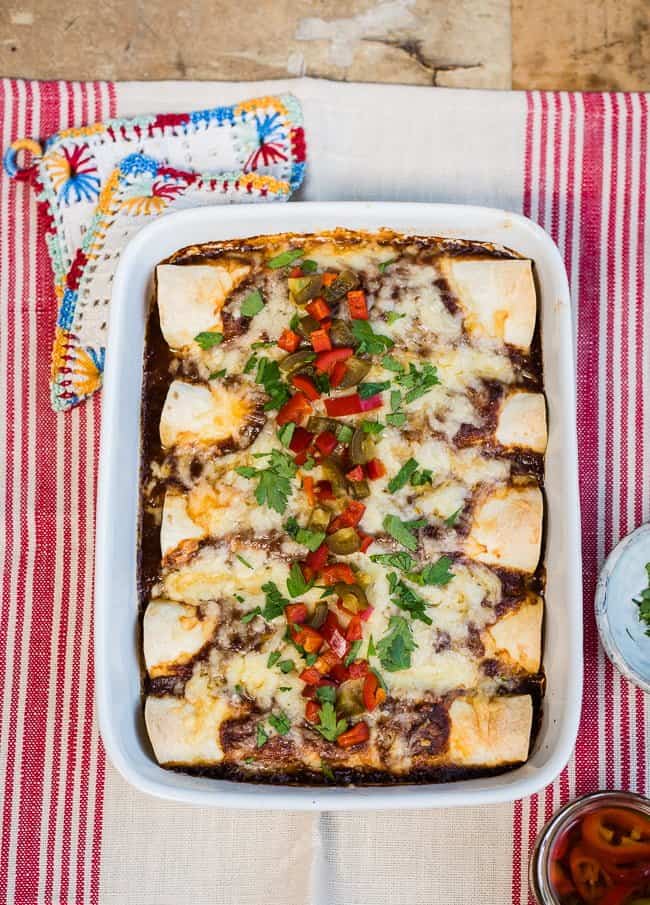 Slow Cooker Mole Pulled Pork Enchiladas – an easy and delicious family meal.