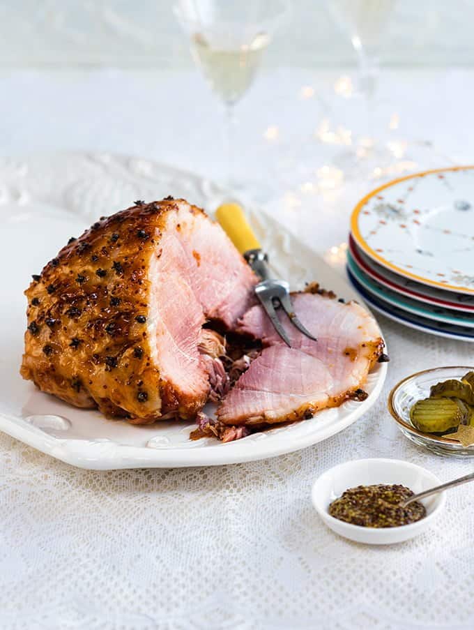 Apricot and mustard glazed ham is a pretty sight on the festive table and perfect for feeding a hungry crowd.