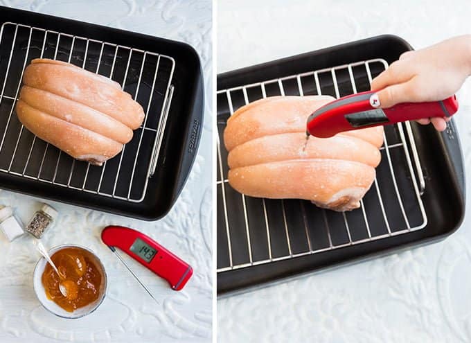 testing the temperature of cooked ham with a digital thermometer