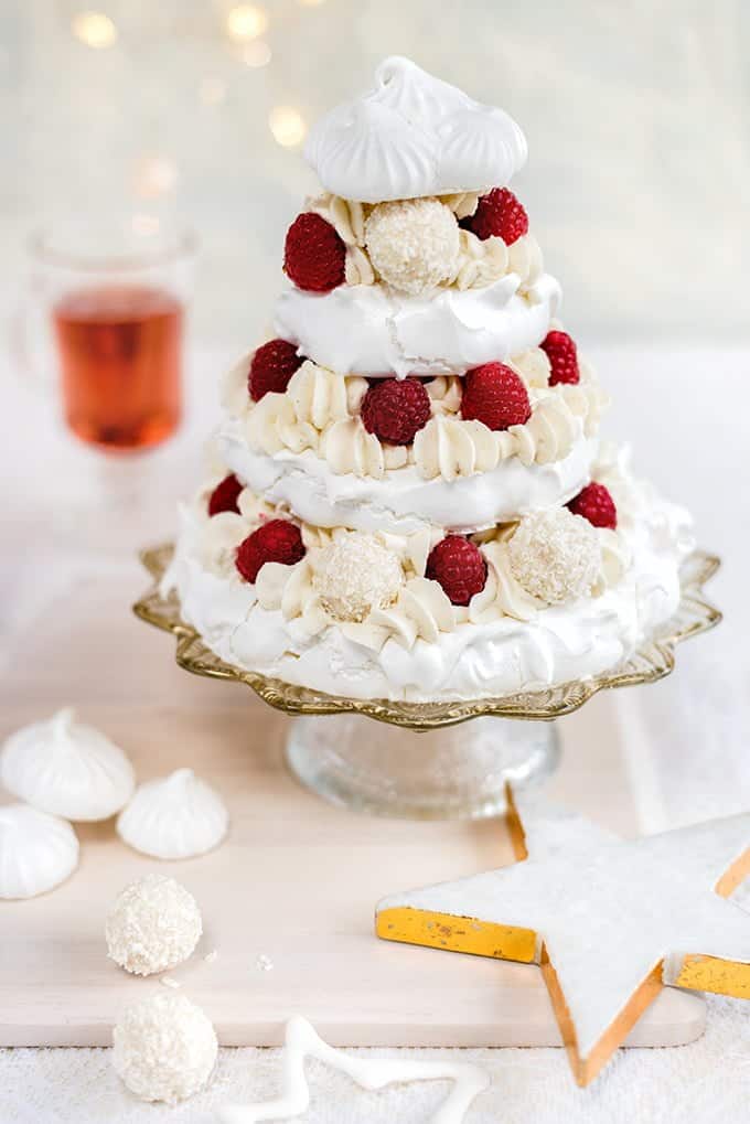 Meringue Christmas tree with whipped coconut cream, raspberries and white chocolate truffles – a spectacular festive dessert!