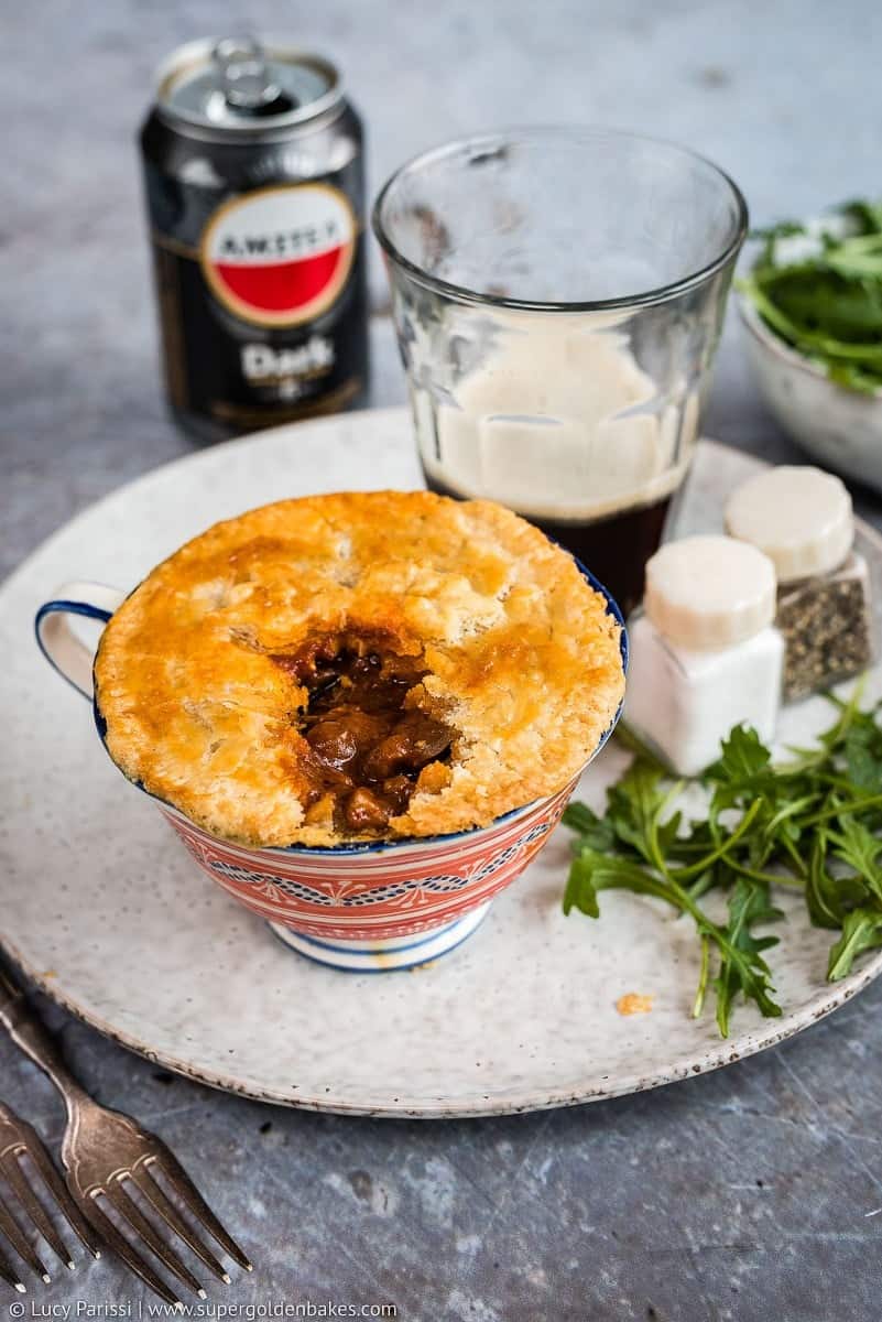 Beef and mushroom pot pies with thyme crust – individual mini-pies filled with delicious slow cooked beef and mushrooms in a dark ale gravy.