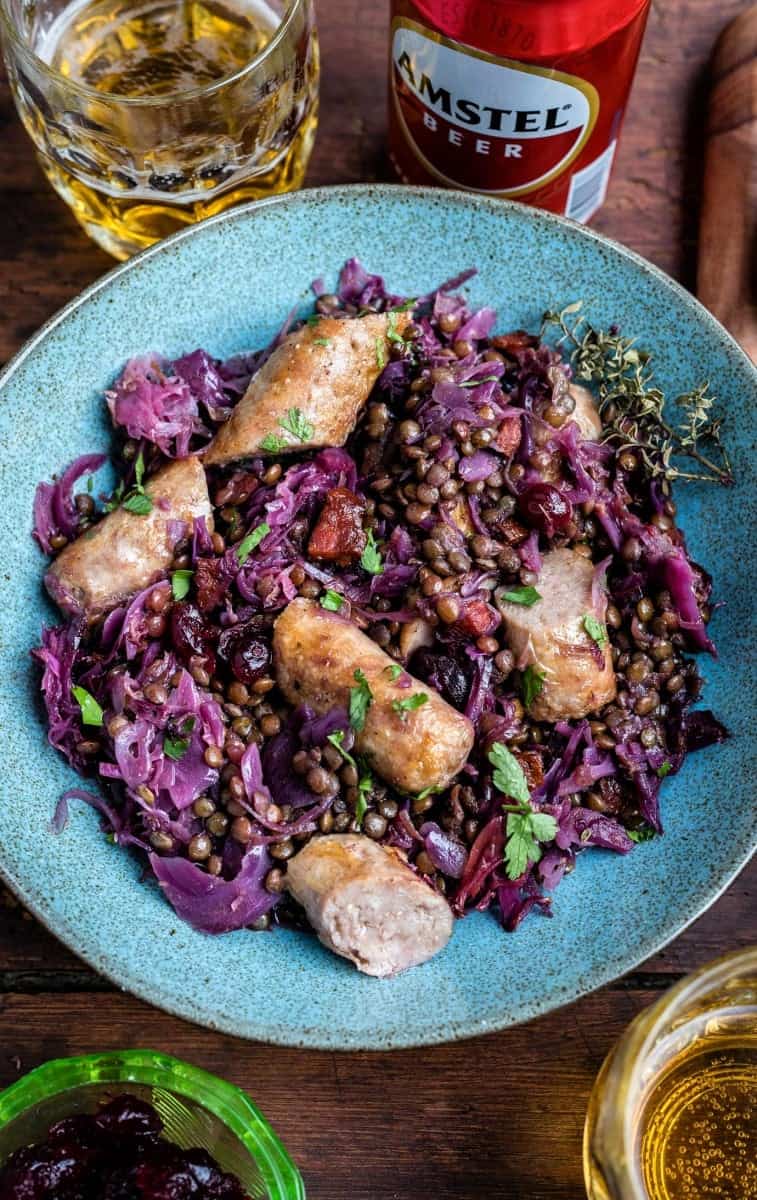 Beer-braised sausages with chorizo, lentils and red cabbage – an easy and satisfying stew that's simply perfect for winter!