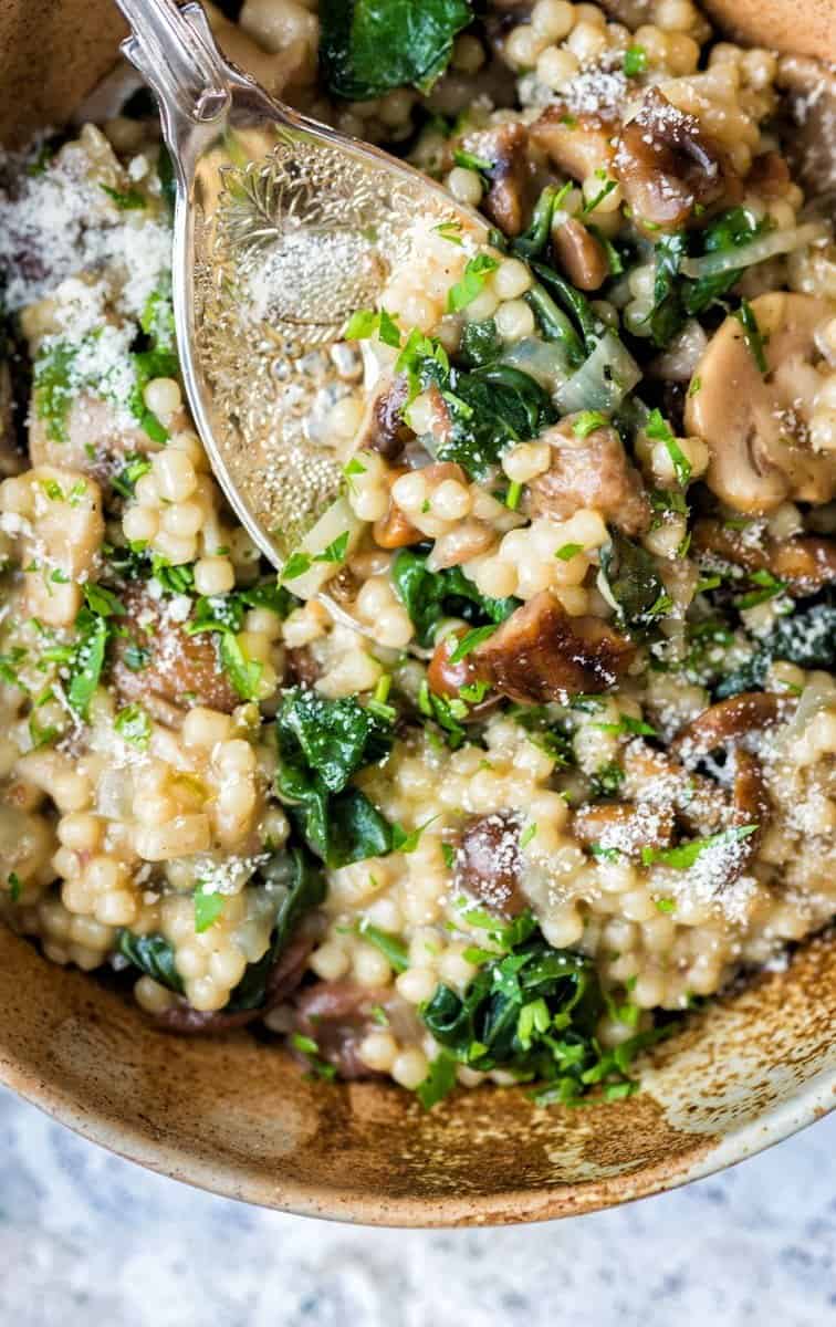 Cheat's risotto with couscous, wild mushrooms, chestnuts, spinach and Parmesan - ready in under 30 minutes!