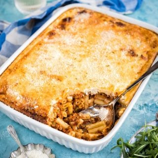 Greek Pastitsio recipe - this mince and pasta bake with cheese sauce combines macaroni and cheese with pasta bolognese for a dish that will be a hit with the entire family.