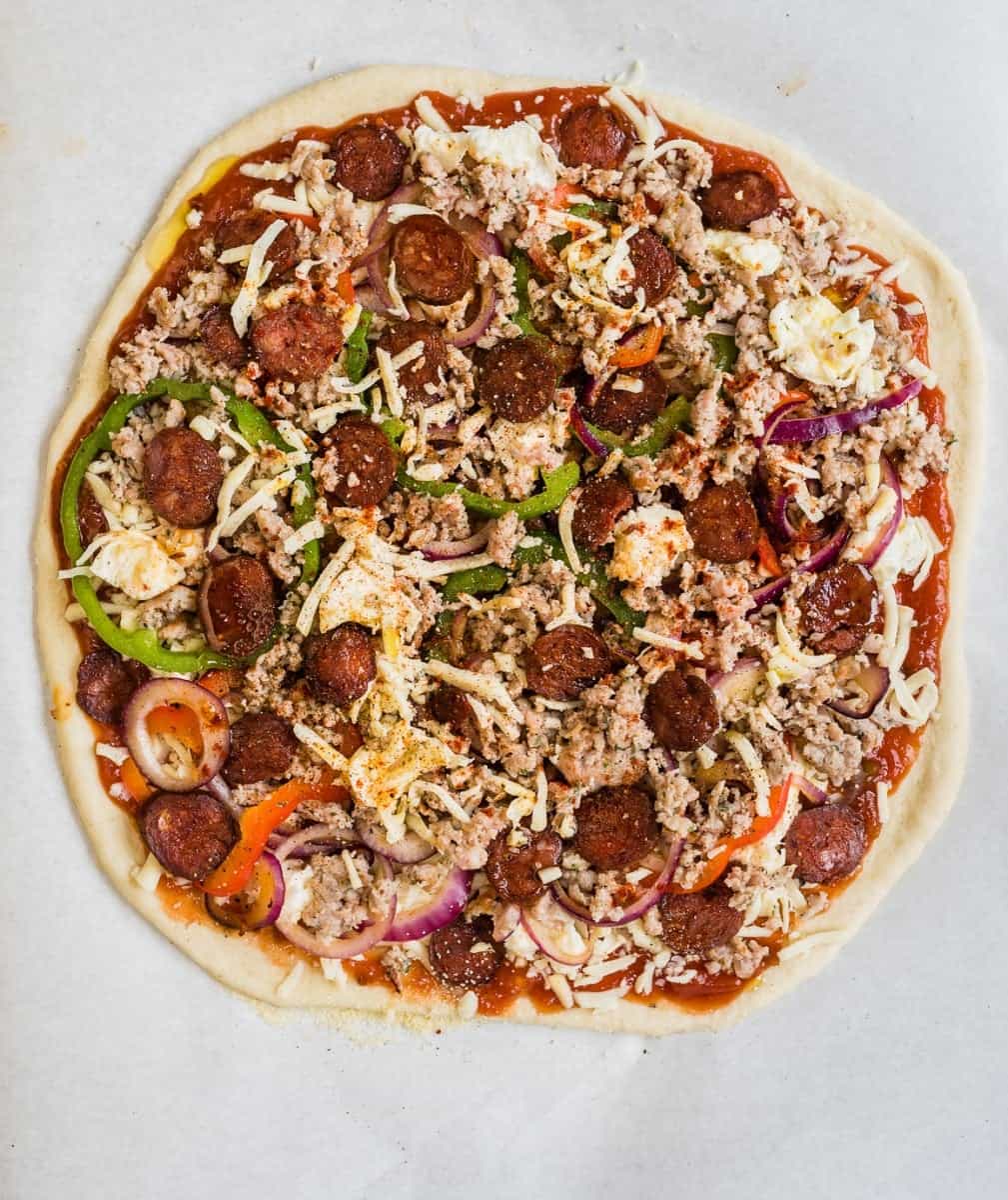 Fully-loaded spicy sausage and pepper pizza - with a salsa base, two types of mozarella, sausage, spicy smoked chorizo, onions and peppers