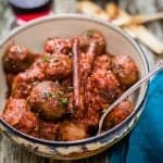 Soutzoukakia: delicious beef meatballs in rich tomato sauce spiced with cumin and cinnamon. Perfect for sharing as meze or as a main meal.