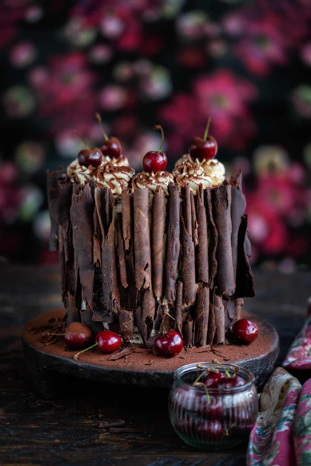 Black Forest Gateau decorated with fresh cherries and chocolate curls