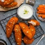 Oven-baked Buffalo chicken fingers with feta yoghurt dip. Spicy, tender and totally addictive!