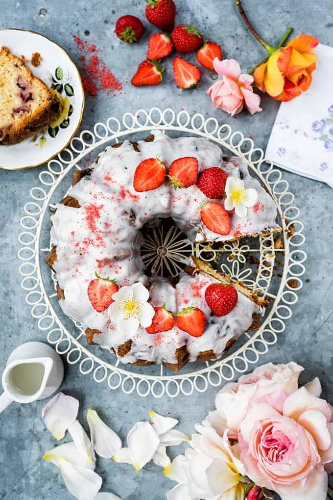 This gorgeous strawberry and rose scented bundt cake is dotted with fresh strawberries and covered with a simple lemon glaze.