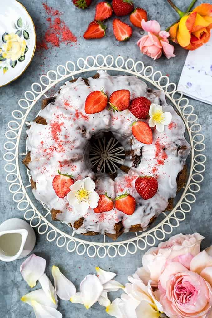 This gorgeous strawberry and rose scented bundt cake is dotted with fresh strawberries and covered with a simple lemon glaze.