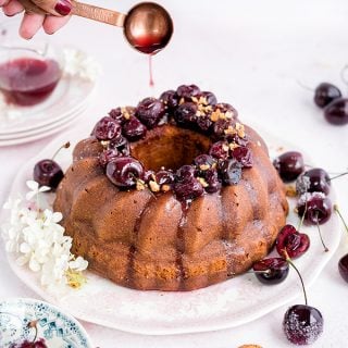 Amaretti ricotta semolina bundt cake with fresh cherry compote – delicious served warm with a little crème fraîche on the side