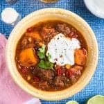 This delicious Tex-Mex beef stew with sweet potatoes is perfect whatever the season! Serve over rice with sour cream and lime wedges on the side.