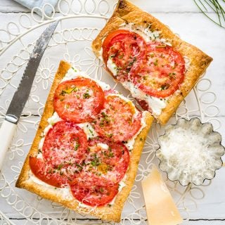 Easy puff pastry tomato tarts with ricotta and feta. An excellent vegetarian starter or light lunch.