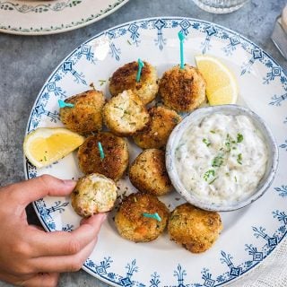 These herby fish croquettes, made with cod, haddock and salmon, are delicious served with easy tartar sauce. Kids and adults will love them! | Supergolden Bakes